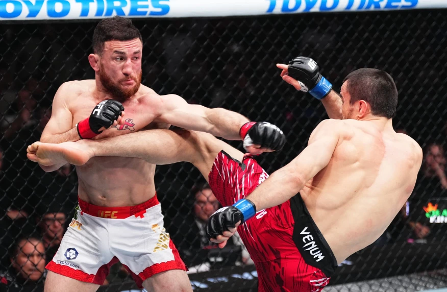Мераб Двалишвили Нурмагомедовты жеңіп, UFC чемпиондық белбеуін қорғады Мераб Двалишвили Нурмагомедовты жеңіп, UFC чемпиондық белбеуін қорғады